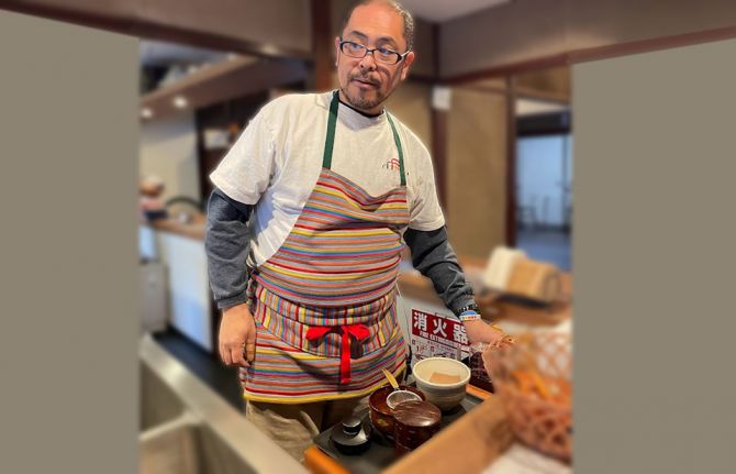 Kennosuke Okumara, head of the Kanazawa centre’s secretariat, serving tea and coffee in the open bar kitchen to visitors.