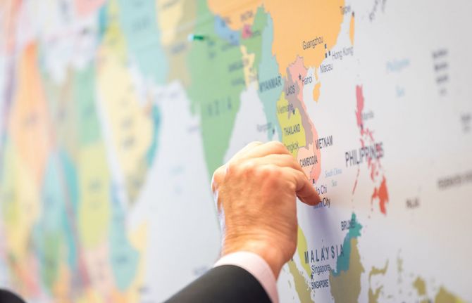 Photo: Albin Hillert/WCC. 20 February 2019, Geneva, Switzerland: People use pins on a map to indicate their trajectory as migrants around the globe.